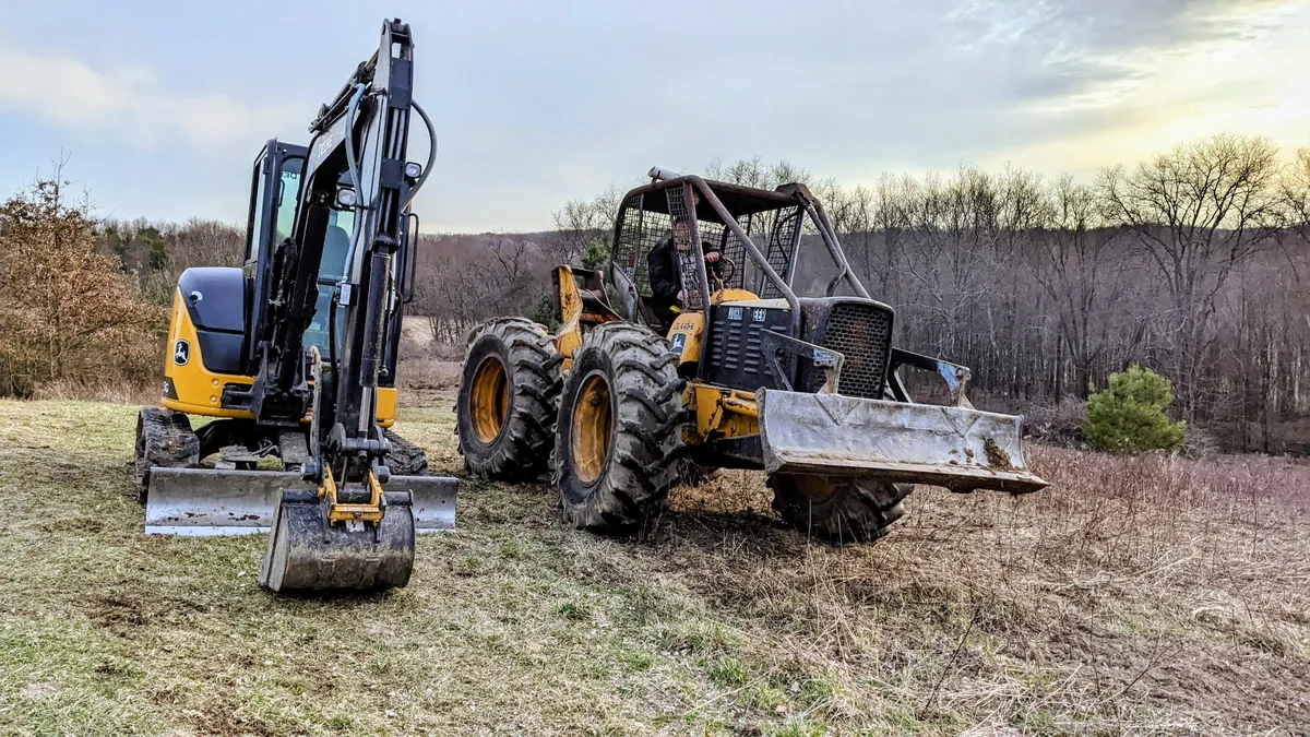 Heavy equipment being used for brush and property cleanup